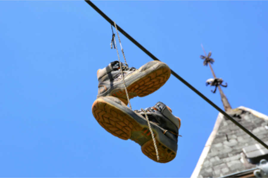 Why Do People Throw Shoes on Power Lines - To Leave A Mark